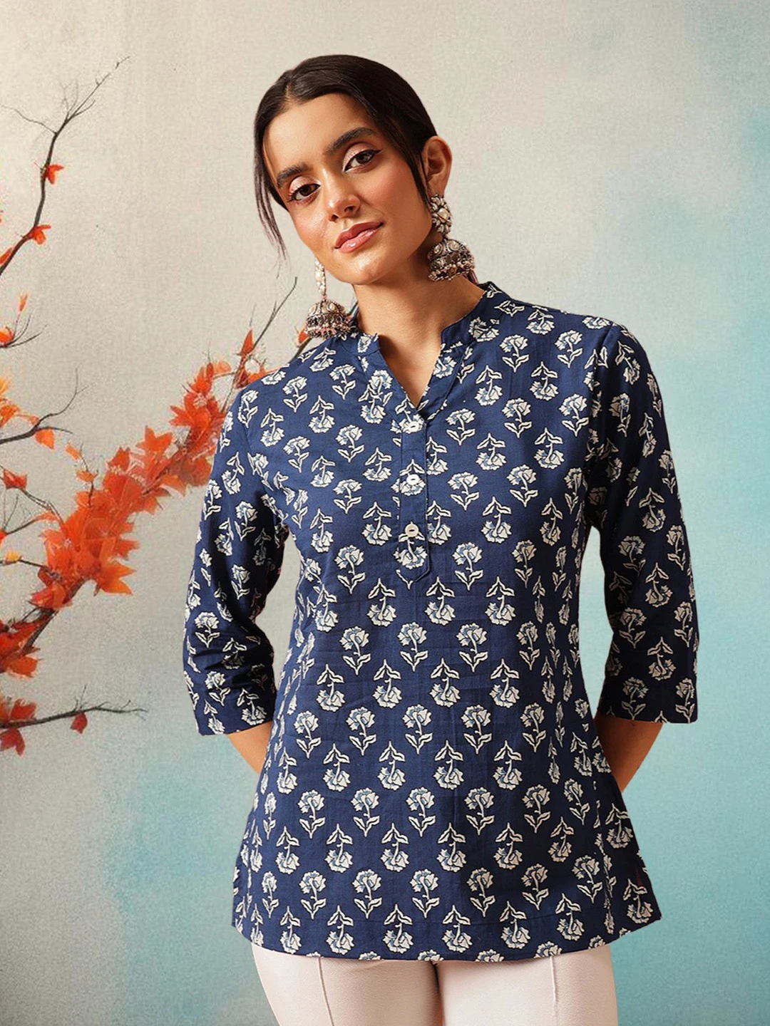 A FEMBLISS indigo block-print kurti shot against a pale painted wall