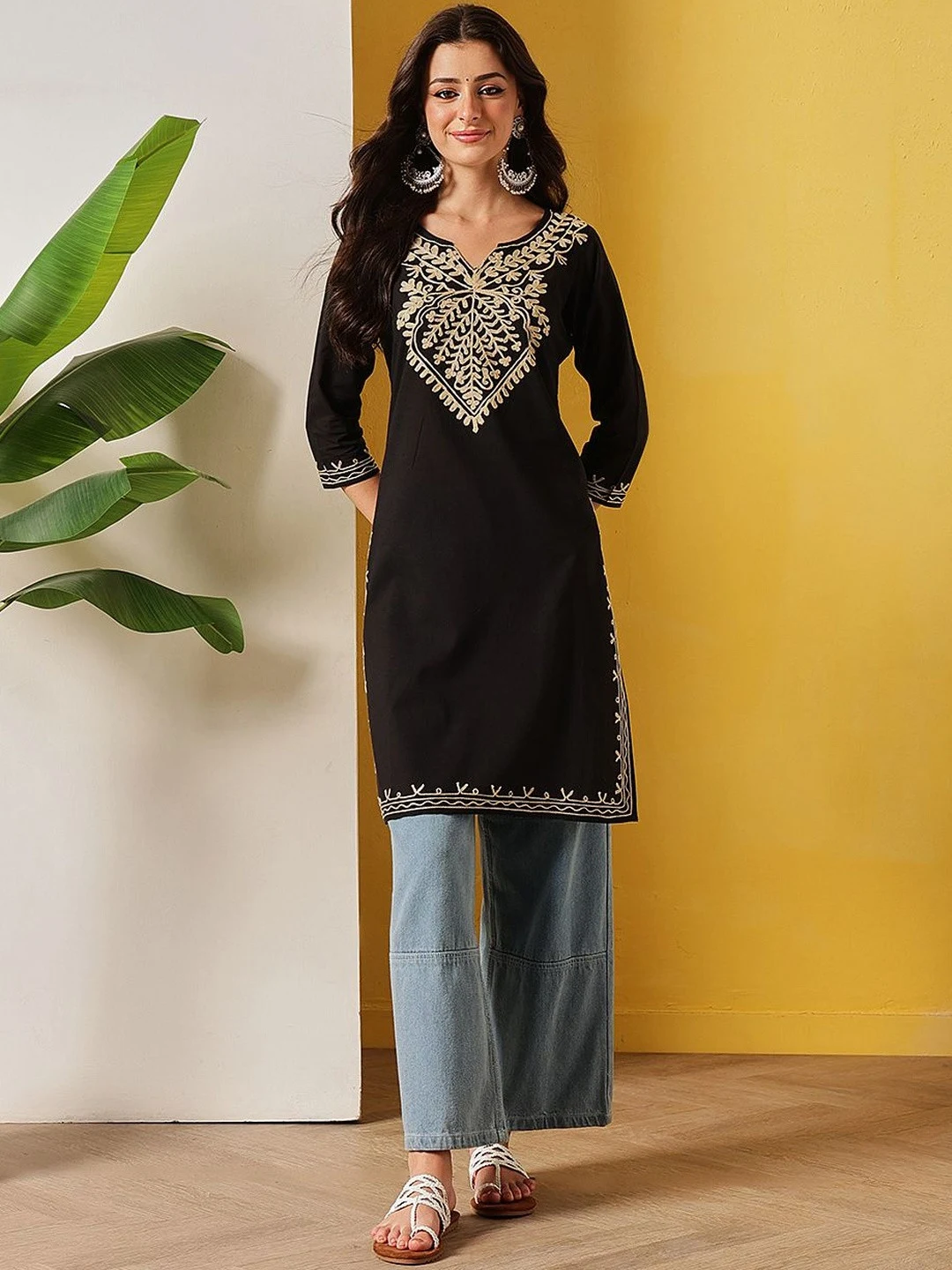 A FEMBLISS black long kurti with white aari work, shot full length