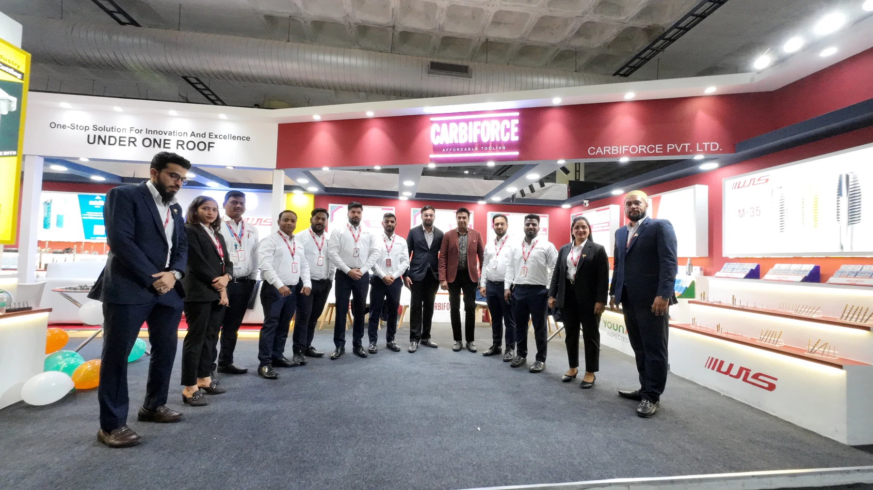 The Carbiforce team lined up across the front of the stand for a group photograph